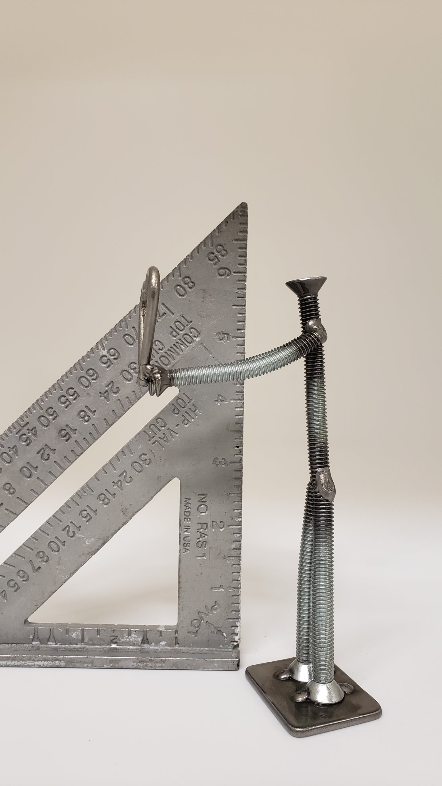 Metal figure holding heart