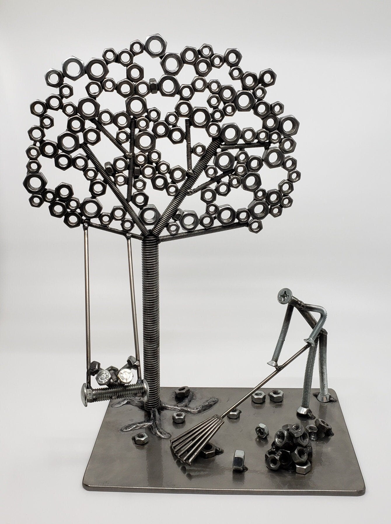 Handcrafted metal tree sculpture made from reclaimed nuts, bolts, and welded steel by DeskPets in Vermont.