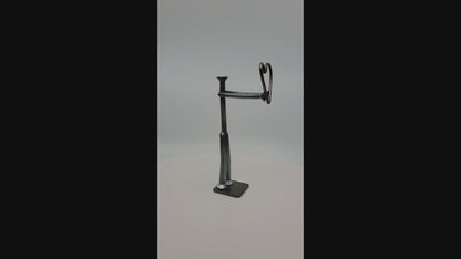 Metal figure holding heart